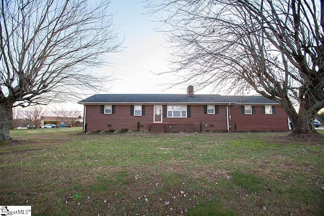 ranch-style house with a front lawn