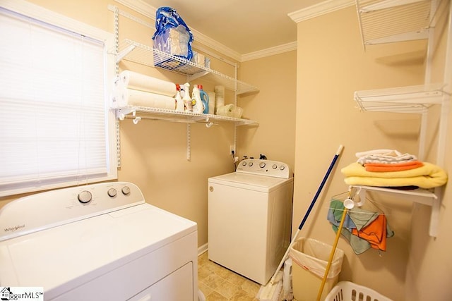 washroom with separate washer and dryer and ornamental molding