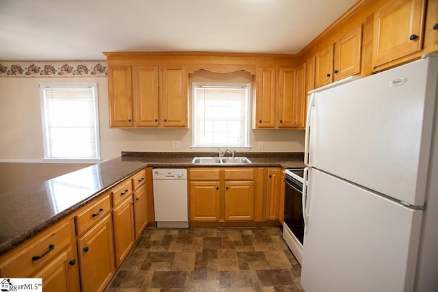 kitchen with sink and white appliances