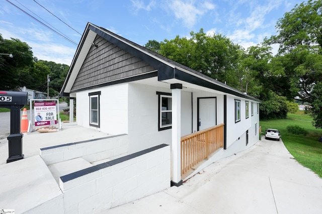 view of home's exterior with covered porch