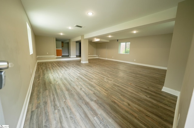 unfurnished living room featuring hardwood / wood-style flooring