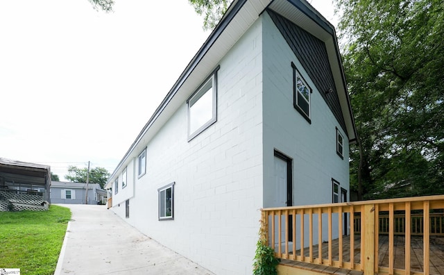 view of side of property with a deck