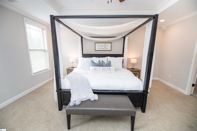 carpeted bedroom featuring multiple windows and ornamental molding