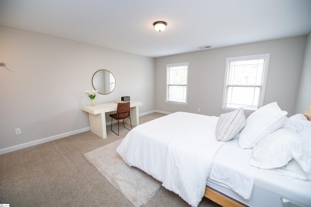 bedroom with light carpet