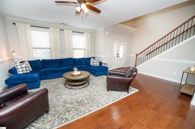 living room with ceiling fan, wood-type flooring, and ornamental molding