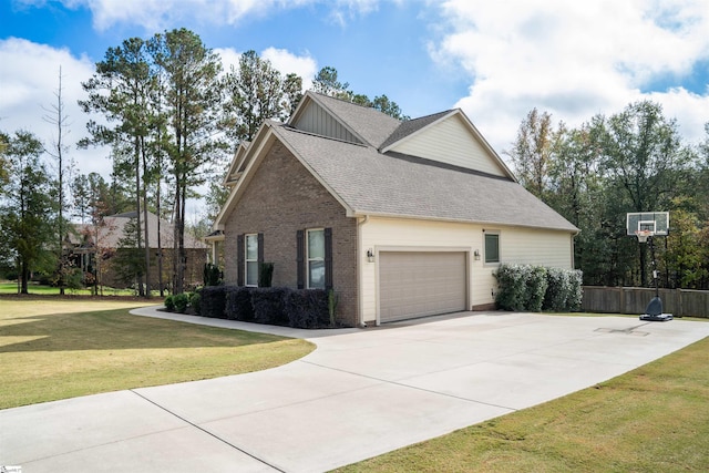 view of home's exterior featuring a yard and a garage