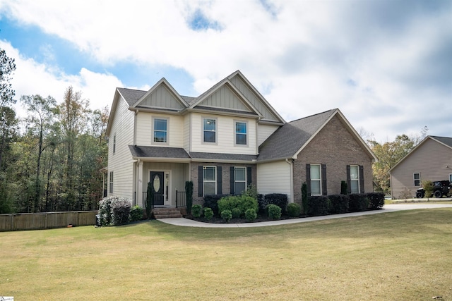 craftsman-style house featuring a front yard