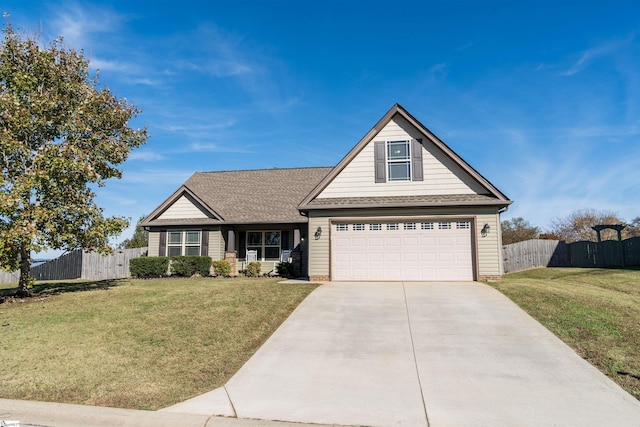 view of front of property featuring a garage and a front lawn