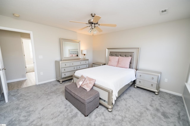 bedroom with ceiling fan and light colored carpet