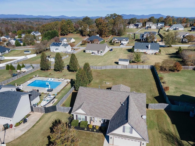 birds eye view of property with a mountain view