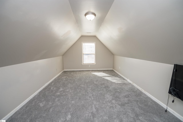 bonus room featuring carpet flooring and vaulted ceiling