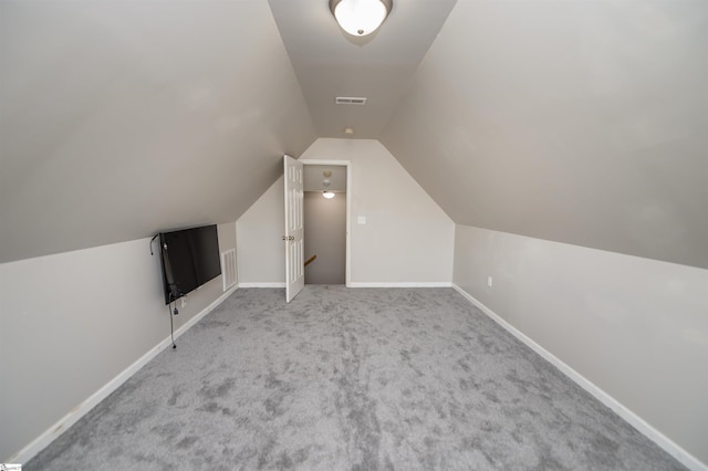 bonus room featuring carpet and lofted ceiling