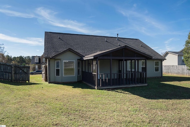 back of property featuring a lawn