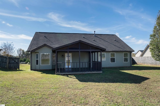 back of house featuring a lawn