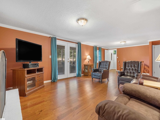 living room featuring french doors, a textured ceiling, crown molding, and wood-type flooring