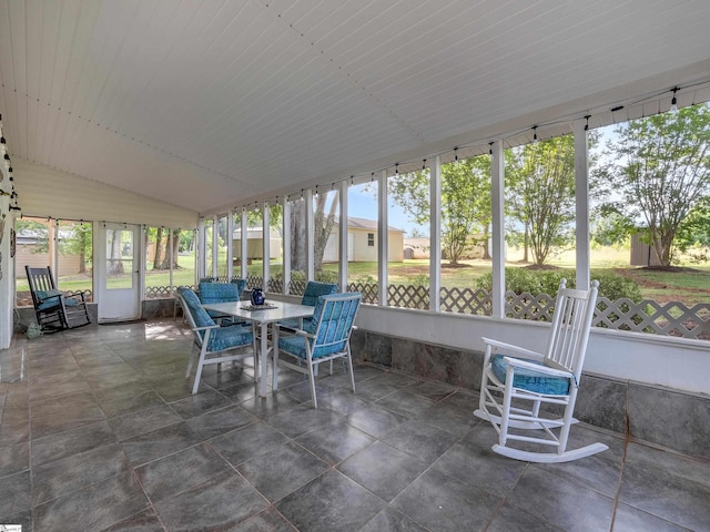 sunroom / solarium with lofted ceiling