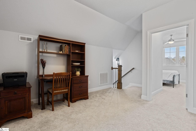 carpeted office with ceiling fan and lofted ceiling