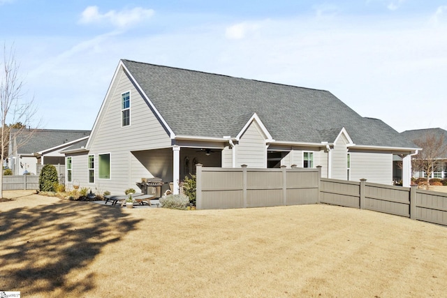 back of house with ceiling fan