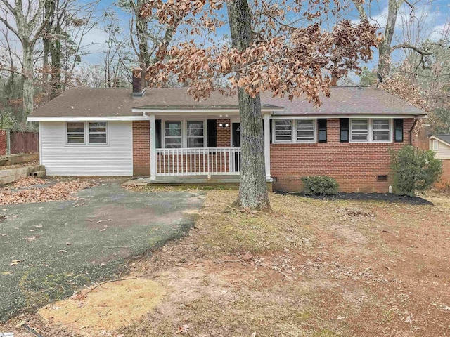 single story home featuring covered porch