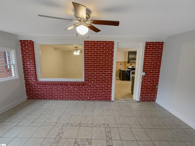 empty room featuring light tile patterned floors and ceiling fan