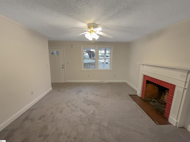 unfurnished living room with ceiling fan, a fireplace, carpet, and a textured ceiling