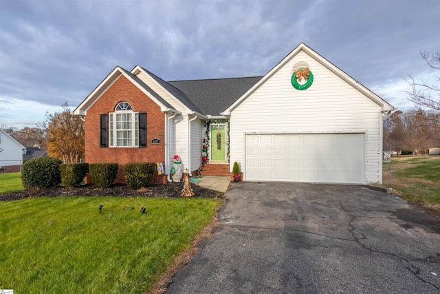 ranch-style home featuring a garage and a front yard