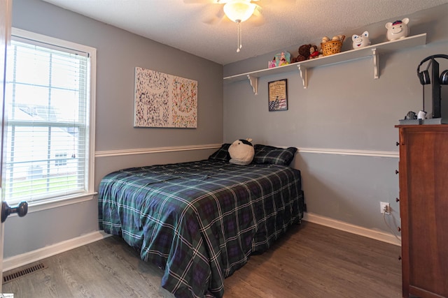 bedroom with ceiling fan and hardwood / wood-style flooring