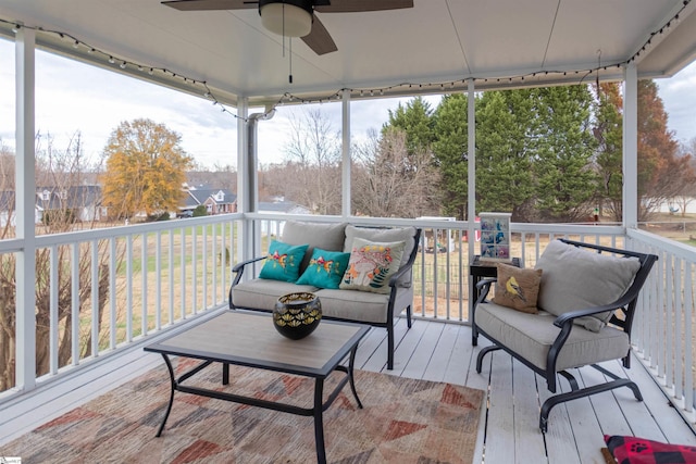 sunroom featuring ceiling fan and a healthy amount of sunlight