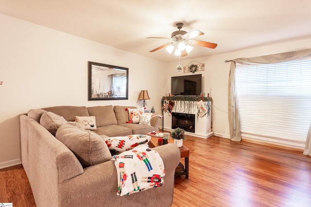 living room with hardwood / wood-style floors and ceiling fan