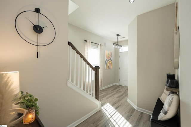 stairway with hardwood / wood-style flooring