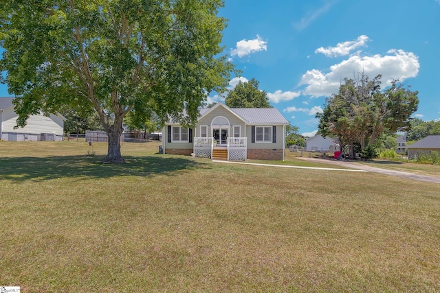 view of front of house with covered porch and a front yard