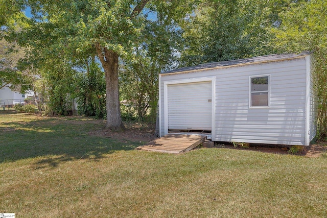 view of outdoor structure with a lawn