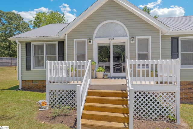 view of front facade with a front yard and a porch