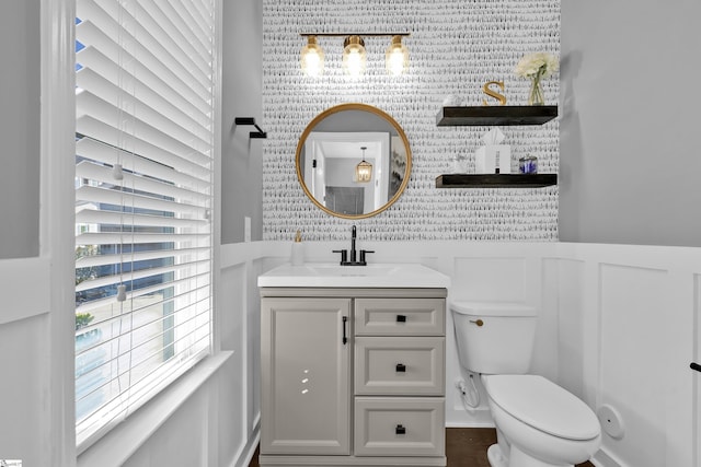 bathroom with vanity and toilet