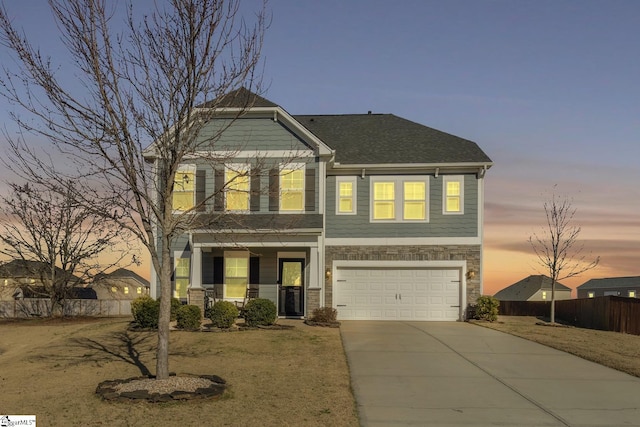 view of front of property with a garage