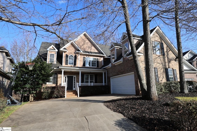 view of front of house with a porch and a garage