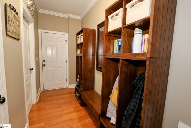 mudroom with crown molding and light hardwood / wood-style floors