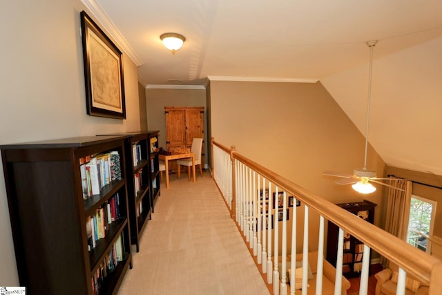 corridor with crown molding, light carpet, and lofted ceiling