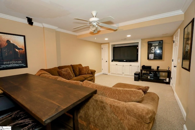 carpeted living room with ceiling fan and ornamental molding