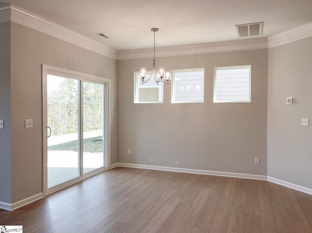 508 Pennystone Ln, Simpsonville, SC 29681 - empty room featuring wood finished floors, crown molding, a chandelier, and visible vents