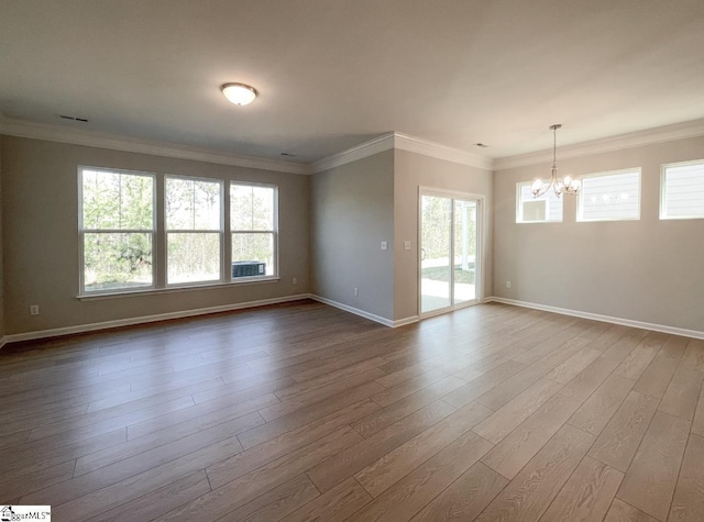 508 Pennystone Ln, Simpsonville, SC 29681 - spare room with baseboards, crown molding, dark wood-type flooring, and an inviting chandelier