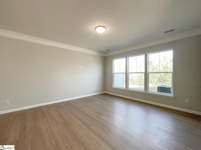 508 Pennystone Ln, Simpsonville, SC 29681 - unfurnished room featuring baseboards, visible vents, crown molding, and dark wood-type flooring