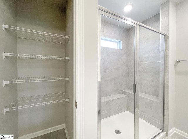 508 Pennystone Ln, Simpsonville, SC 29681 - bathroom with a spacious closet, baseboards, and a shower stall