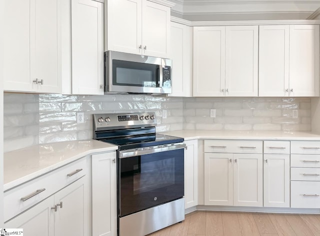 508 Pennystone Ln, Simpsonville, SC 29681 - kitchen with white cabinets, appliances with stainless steel finishes, and tasteful backsplash