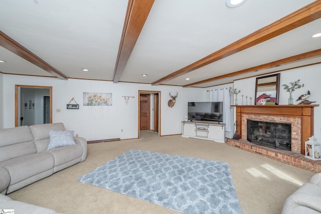 living room featuring beamed ceiling, light colored carpet, and a fireplace