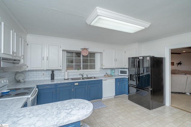 kitchen with blue cabinetry, sink, white appliances, decorative backsplash, and white cabinets