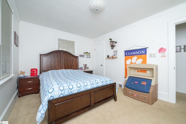 carpeted bedroom featuring ornamental molding