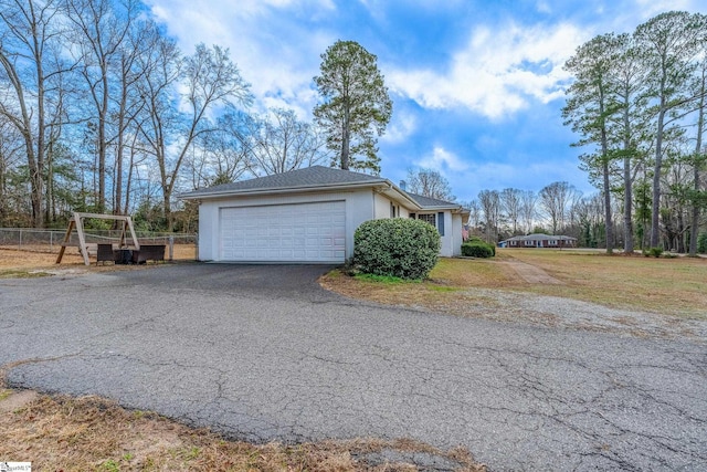 view of side of property featuring a garage