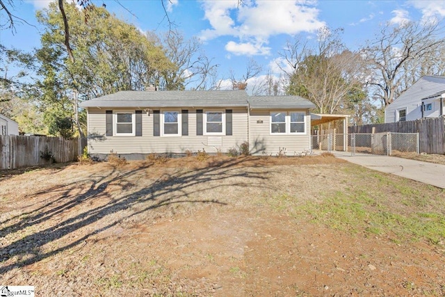 ranch-style home featuring a carport