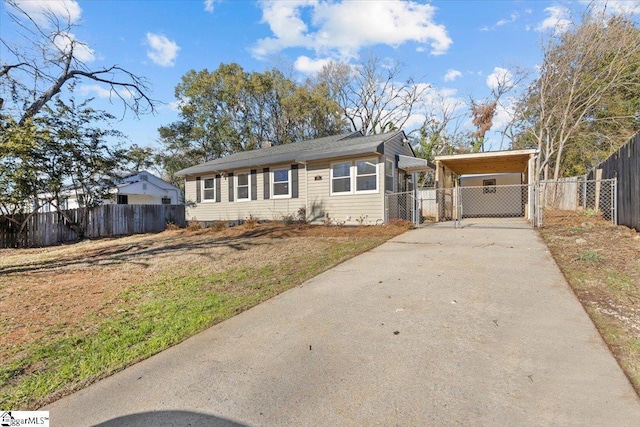 view of front of property featuring a carport